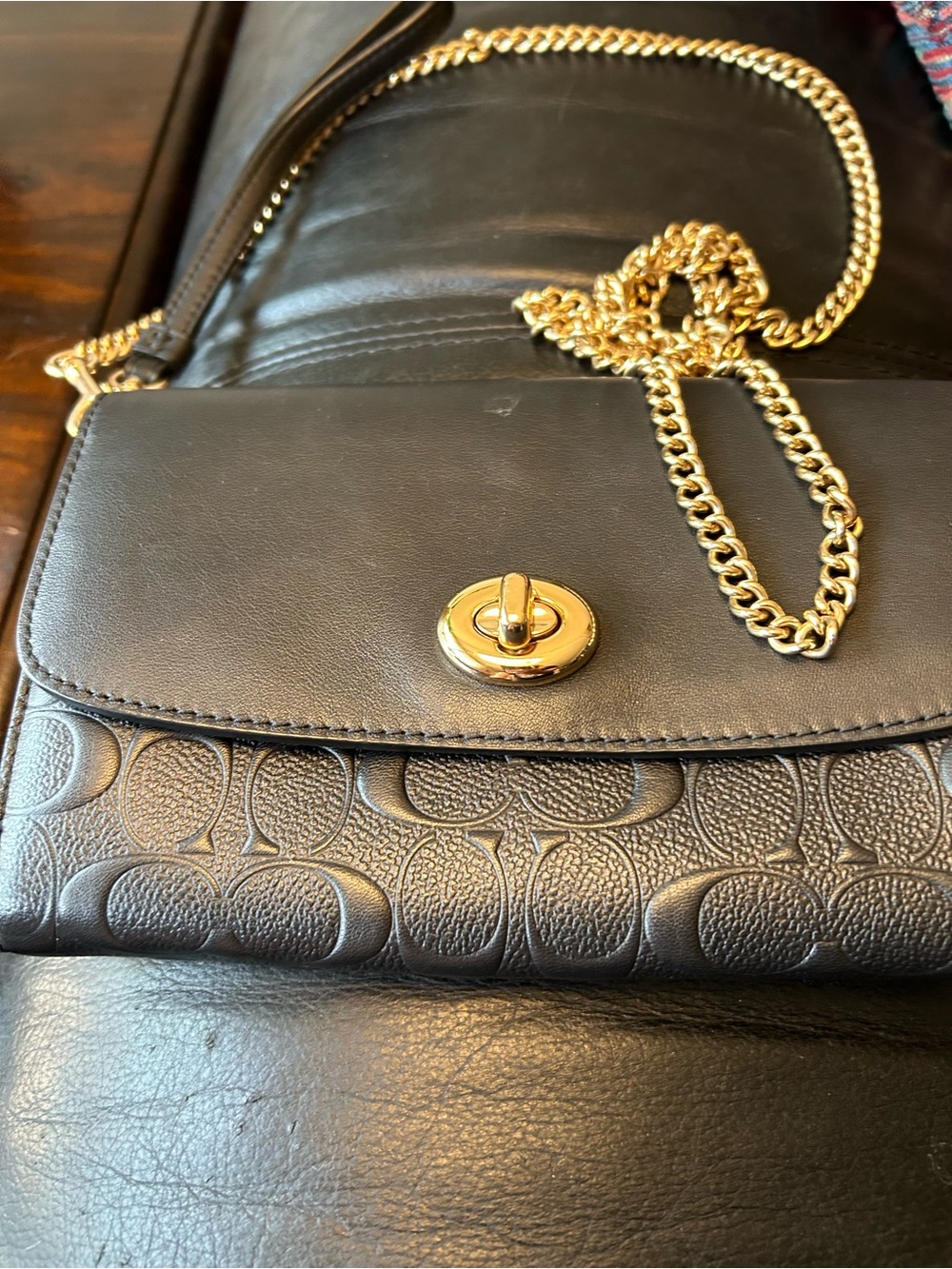 Coach Black Leather Crossbody with Gold Turnlock and Chain